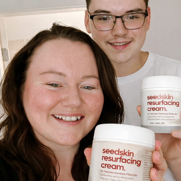 Two people holding jars of seedskin resurfacing cream.